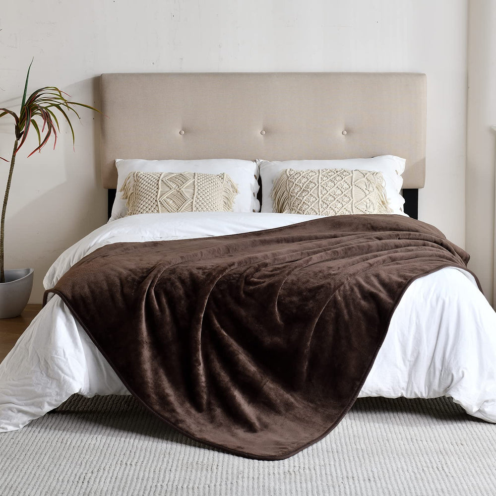 Yaning brown 60x80 inch blanket spread on sofa for furniture protection.
