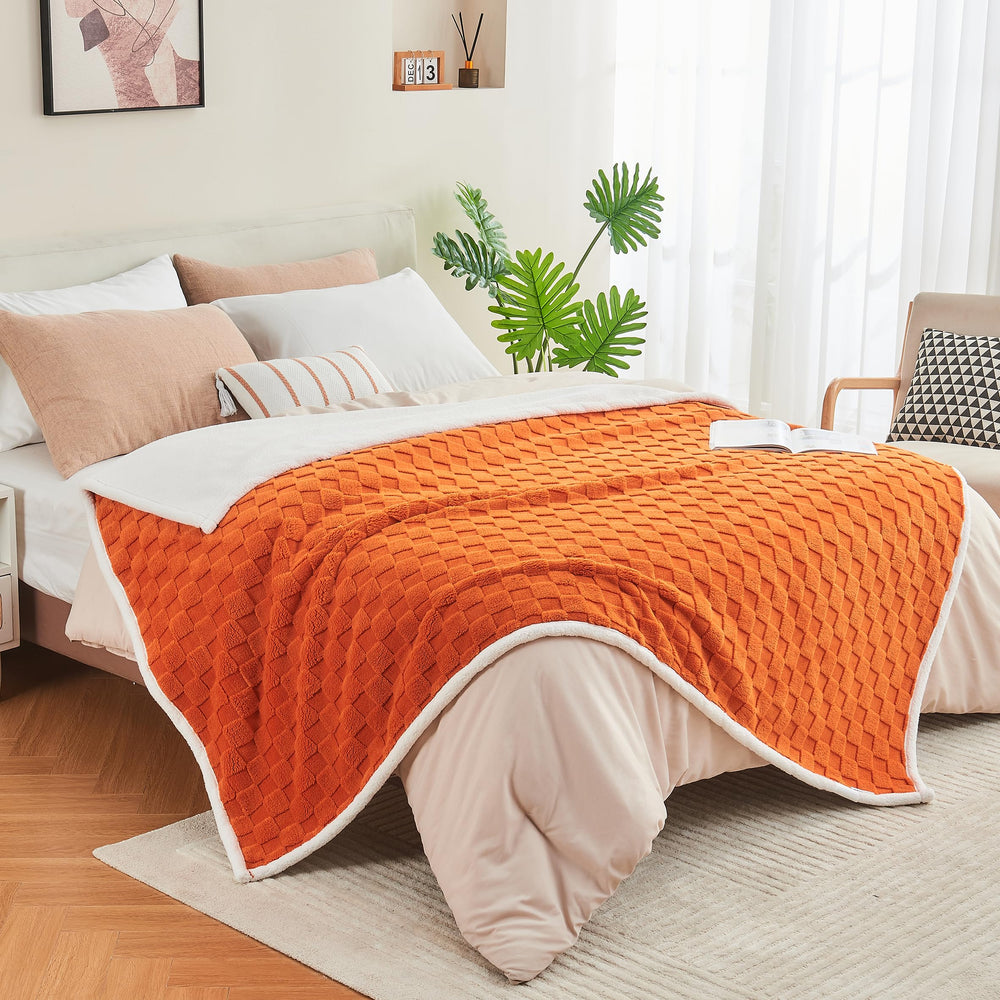 Yaning checkered waterproof blanket in burnt orange brightens rooms while protecting furniture.