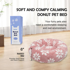 Yaning donut bed with raised rim provides head and neck support for restful lounging.