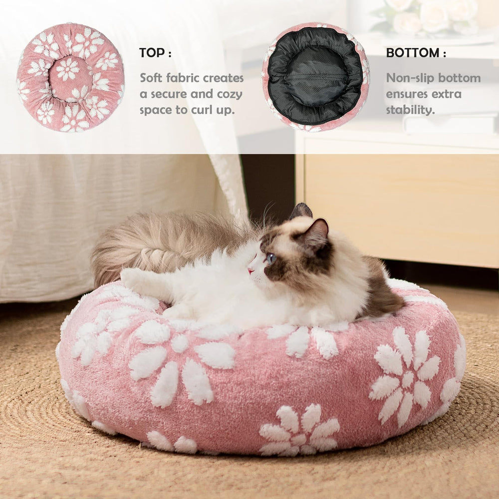 Yaning donut dog bed with soft plush fabric provides a plush resting surface.