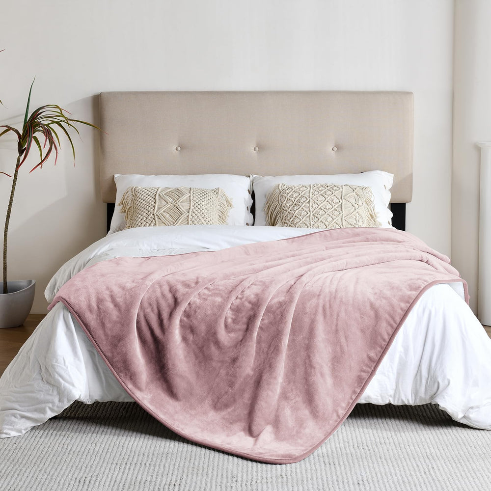Yaning dusty pink waterproof blanket on sofa protects furniture.