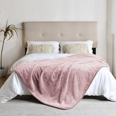 Yaning dusty pink waterproof blanket on sofa protects furniture.