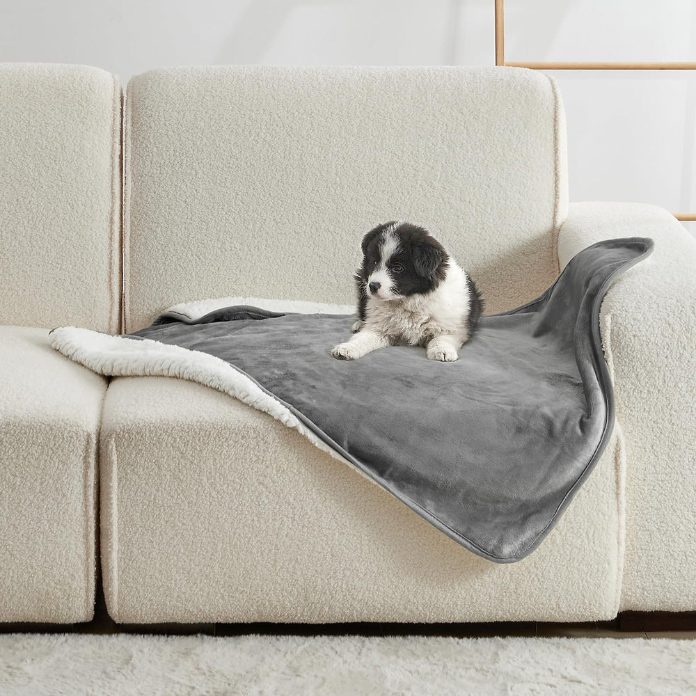 Yaning waterproof blanket on bed protects from spills and pet hair.