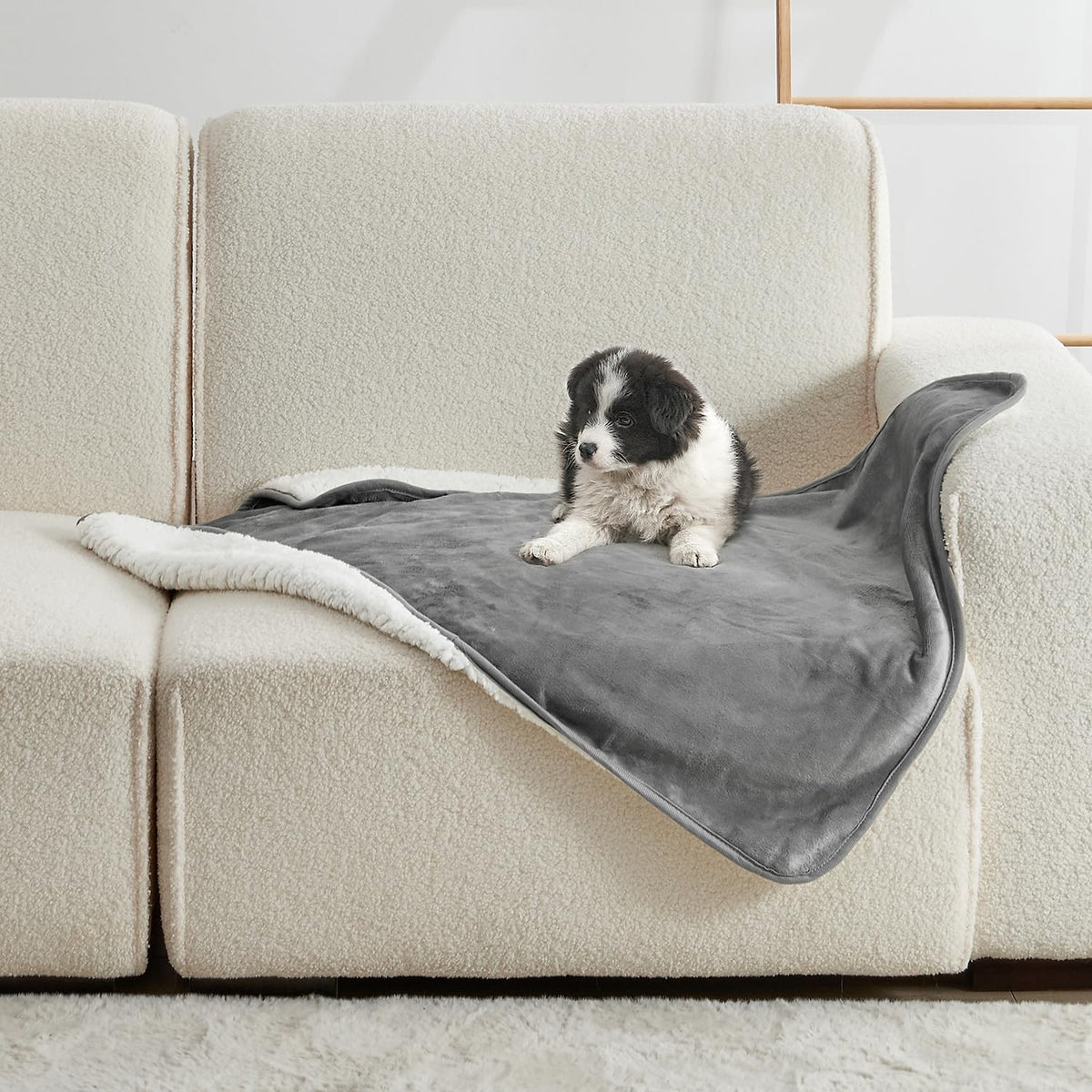 Yaning waterproof blanket on bed protects from spills and pet hair.