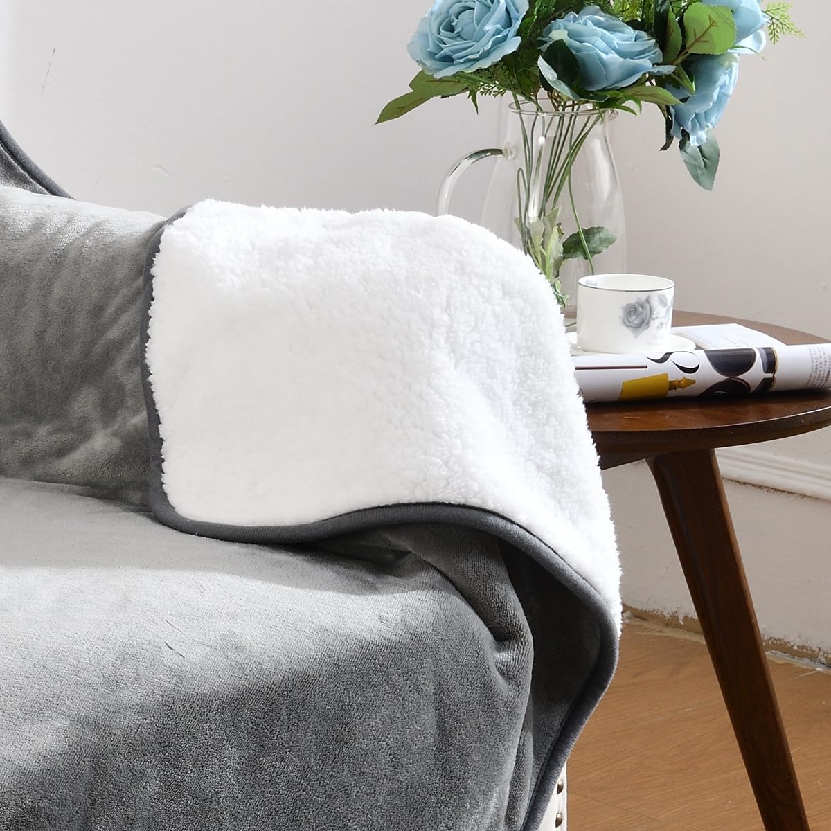 Yaning blanket on couch provides fur and spill protection.