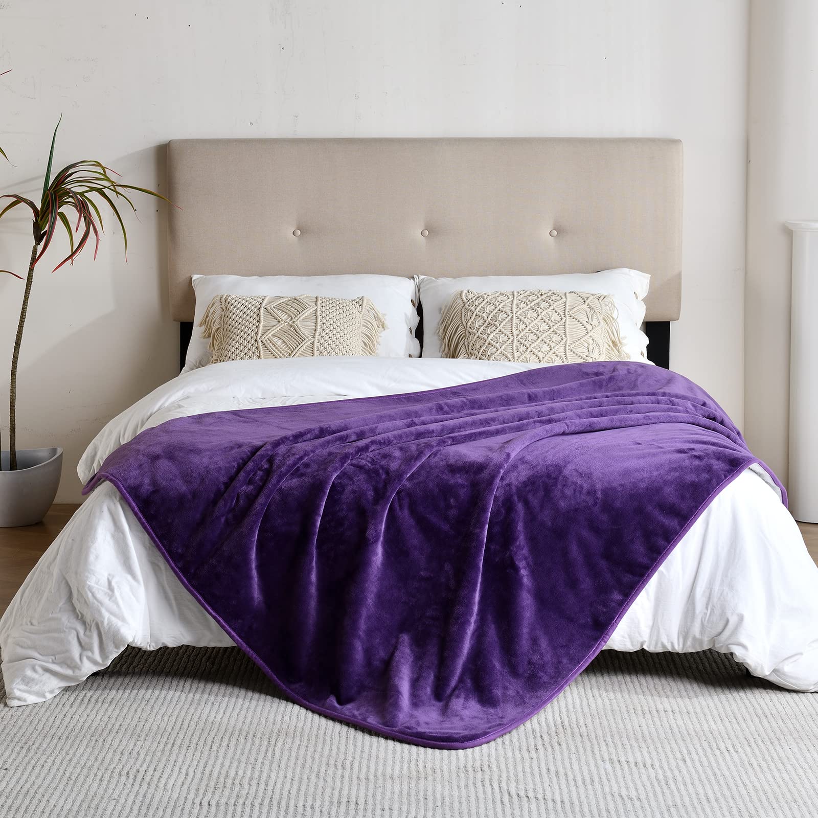 Yaning waterproof blanket with flannel side on couch for cozy comfort.