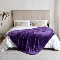 Yaning waterproof blanket with flannel side on couch for cozy comfort.