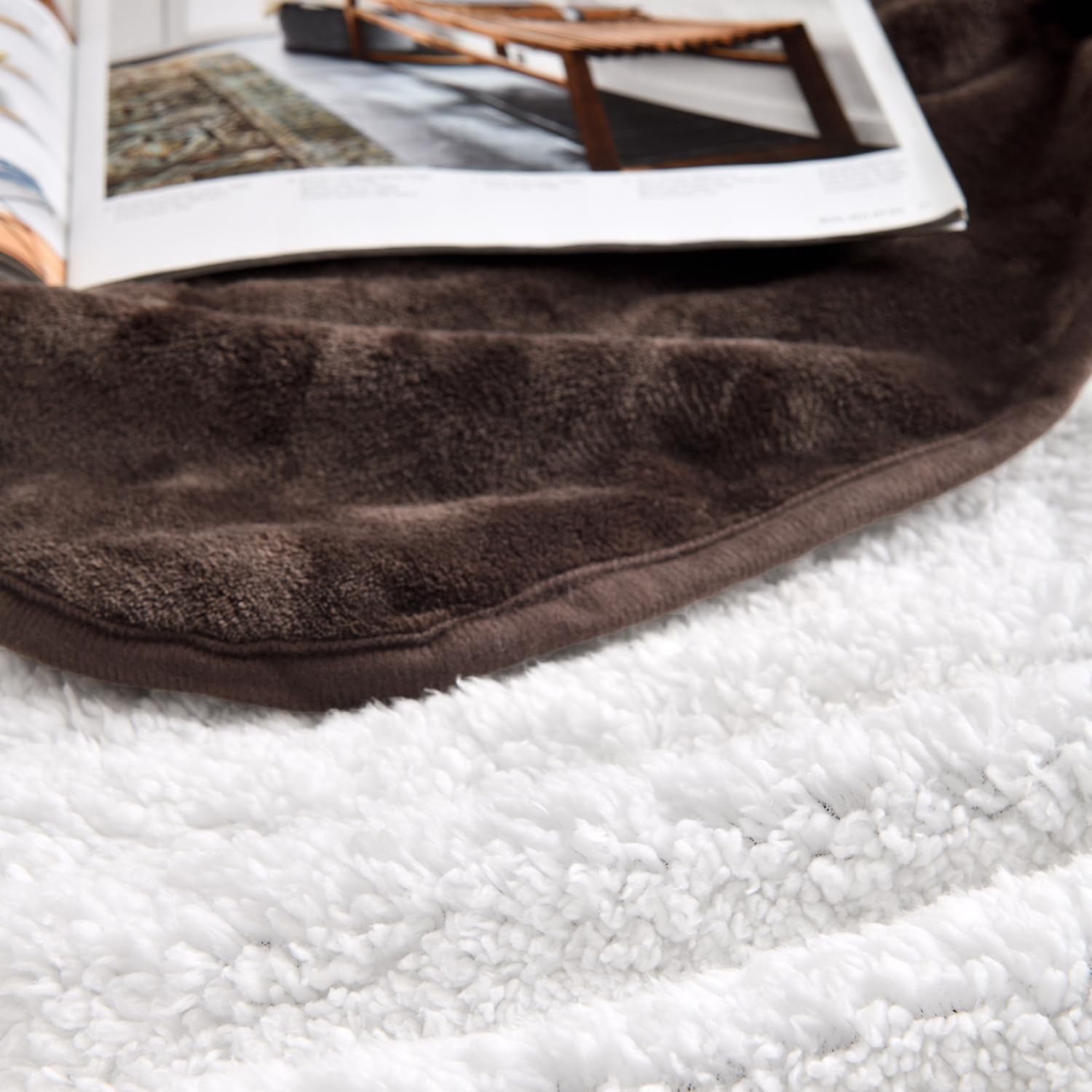 Yaning blanket shows reversible Sherpa and Flannel sides for cozy warmth.