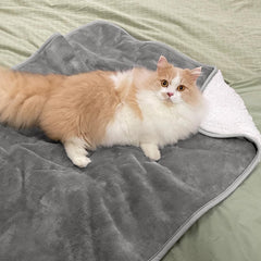 Yaning waterproof blanket showing reversible sherpa and flannel sides for comfort.