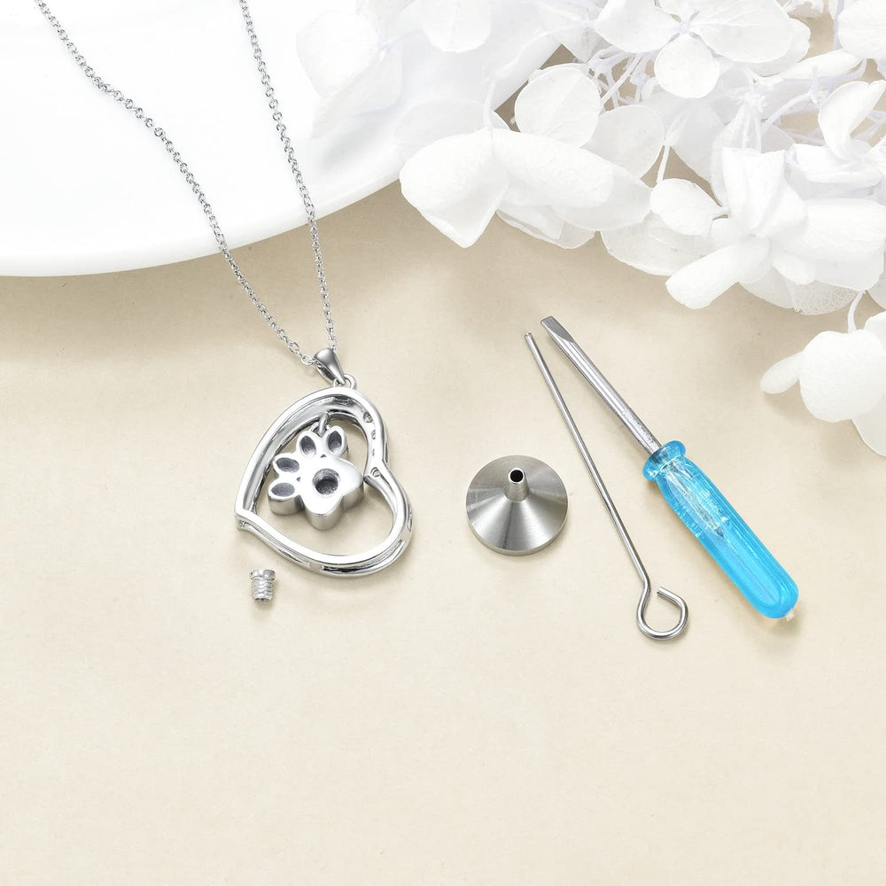 YFN paw ashes pendant worn by a woman as keepsake.