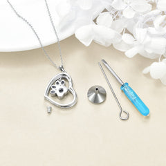 YFN paw ashes pendant worn by a woman as keepsake.