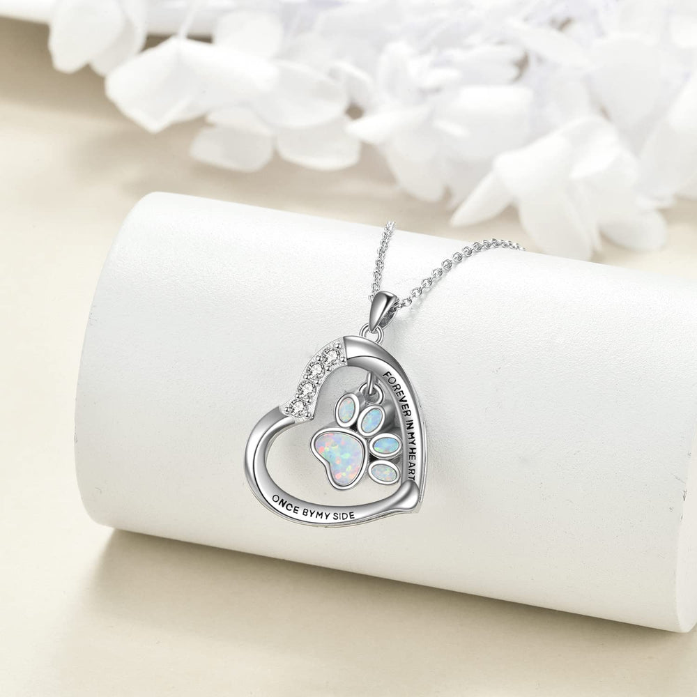 YFN paw urn necklace engraving detail highlighting memorial message.