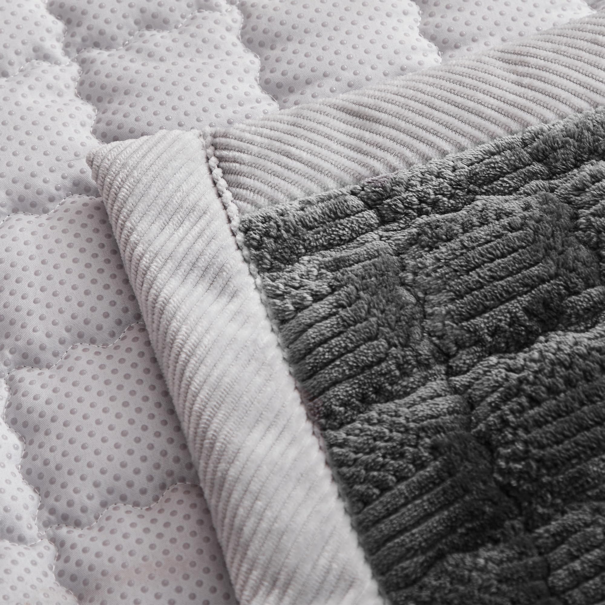 YJSMMXY couch cover features back silicone particles to help stay secure.