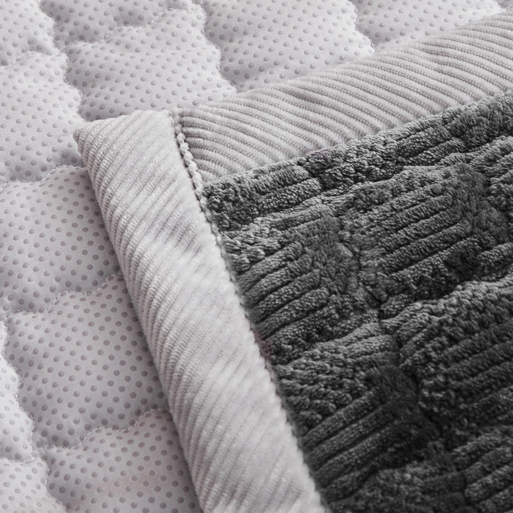 YJSMMXY couch cover features back silicone particles to help stay secure.