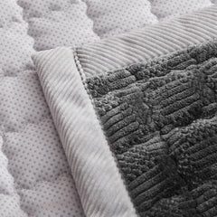 YJSMMXY couch cover features back silicone particles to help stay secure.
