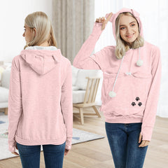 YYW pink hoodie model wearing with pet in pouch for comfortable interaction