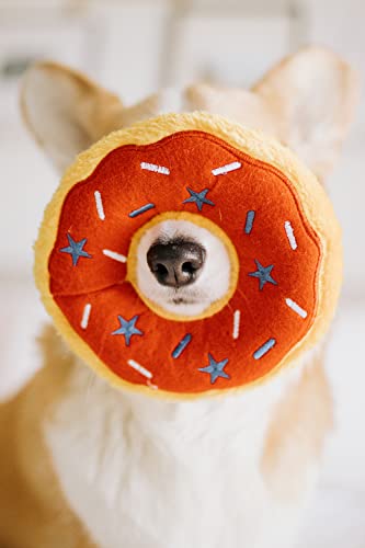 ZippyPaws Americana Jumbo Donutz in action during outdoor playtime for enrichment.